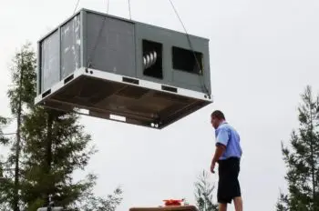 Sequoia Air Co. installing a rooftop HVAC unit with a crane